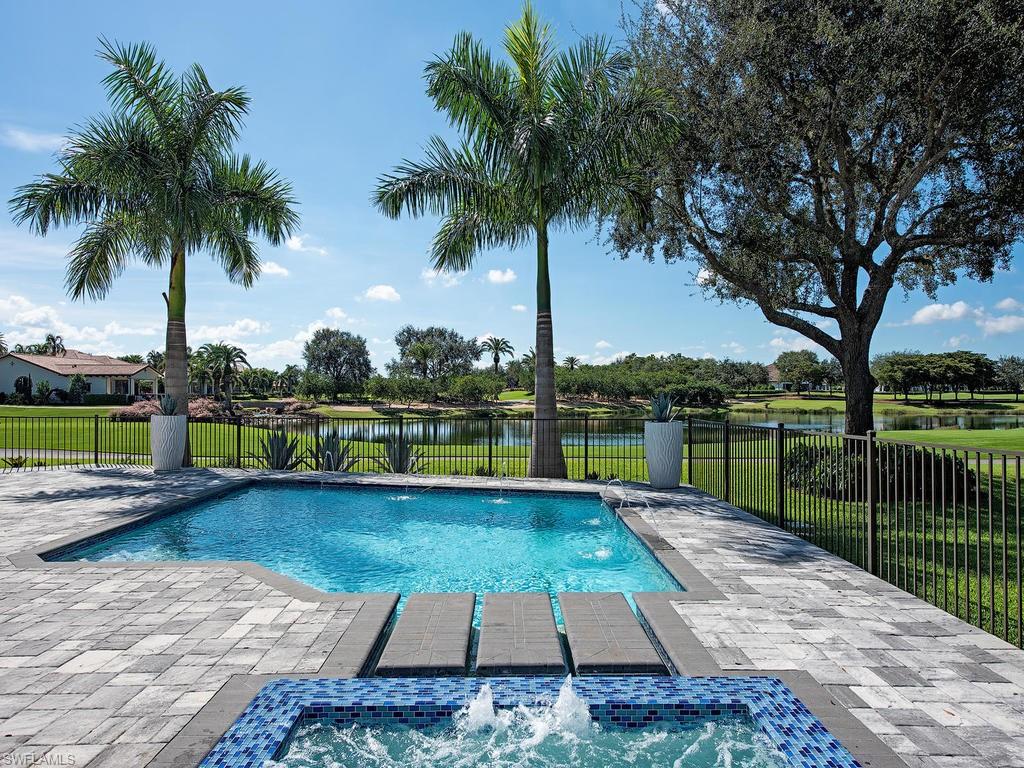16868 Brightling Way Naples, FL 34110 - Photo 27 of 35 a view of a lake with a yard and potted plants