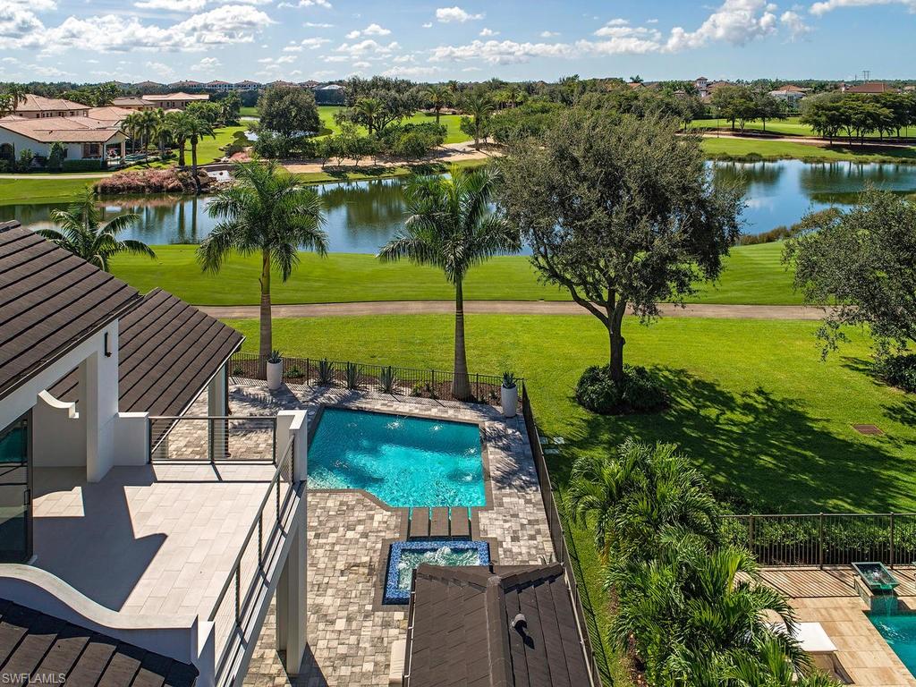 16868 Brightling Way Naples, FL 34110 - Photo 28 of 35 a view of a swimming pool with a patio