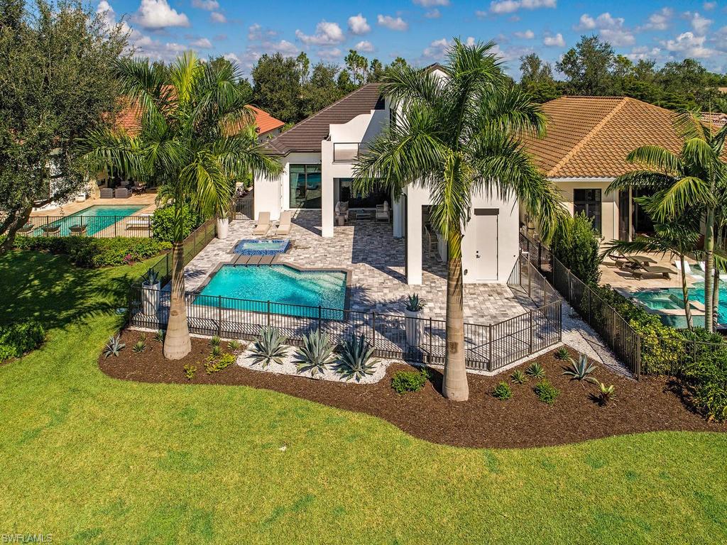 16868 Brightling Way Naples, FL 34110 - Photo 29 of 35 a front view of a house with garden