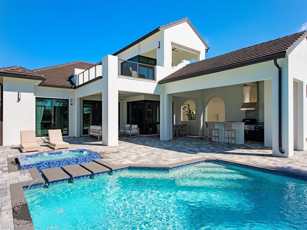 16868 Brightling Way Naples, FL 34110 - Photo 31 of 35 a view of a house with backyard porch and sitting area