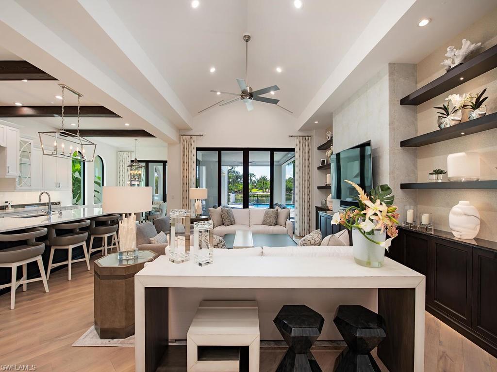 16868 Brightling Way Naples, FL 34110 - Photo 5 of 35 a view of a dining room with furniture window and wooden floor