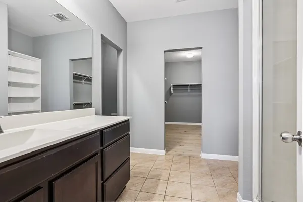 a room with a cabinets and appliances