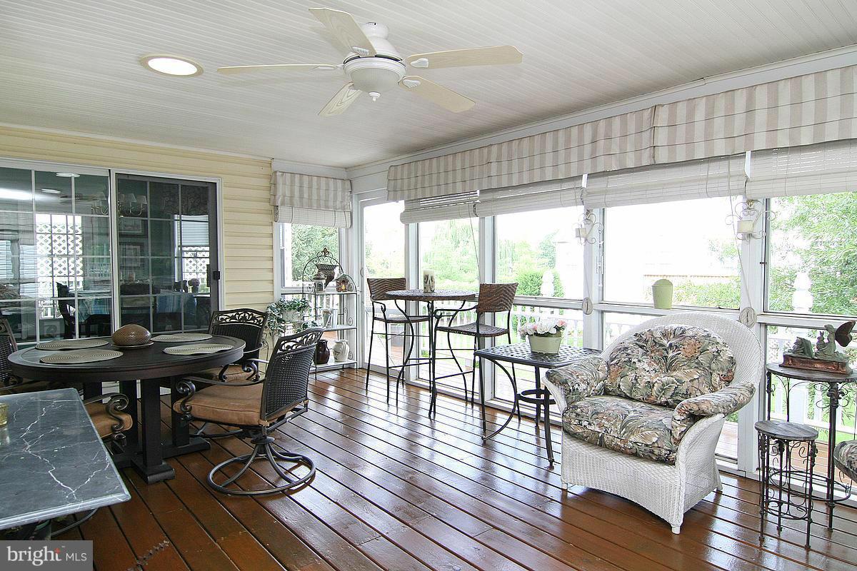 2560 Bear Den Road Frederick, MD 21701 - Photo 14 of 30 a living room with furniture large windows and wooden floor