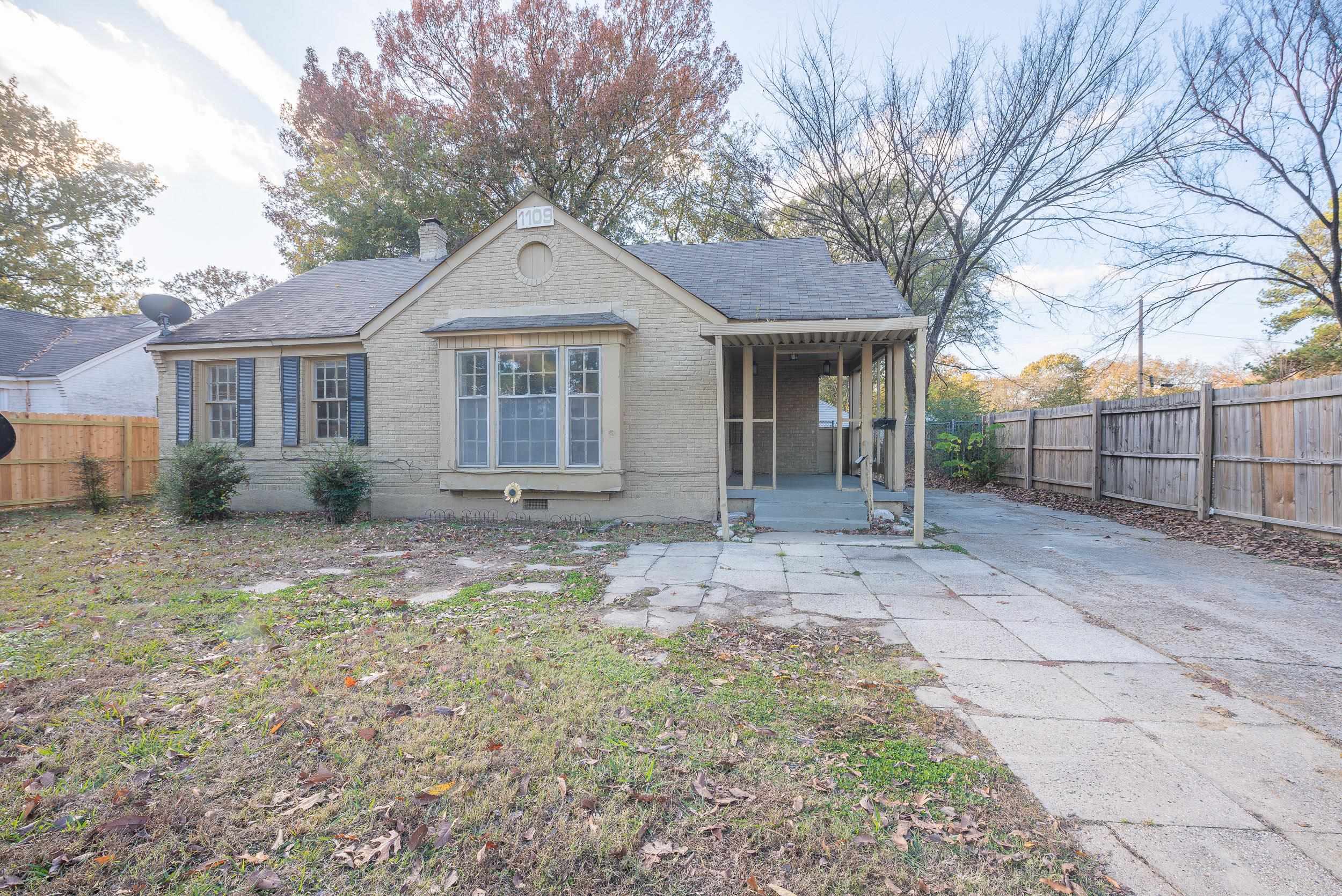 1109 Getwell Road Memphis, TN 38111 - Photo 1 of 22 front view of a house with a yard