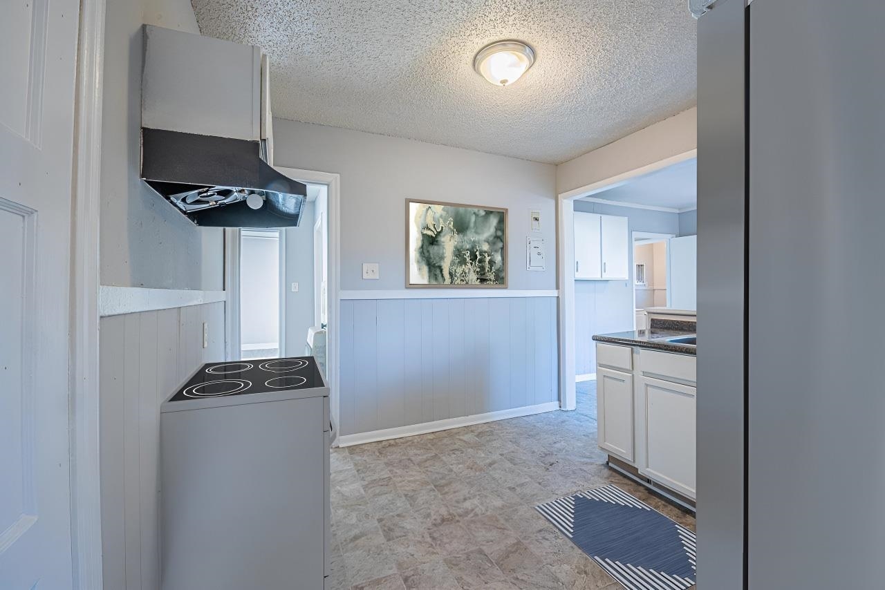 1109 Getwell Road Memphis, TN 38111 - Photo 7 of 22 a kitchen with stainless steel appliances a refrigerator and a stove top oven