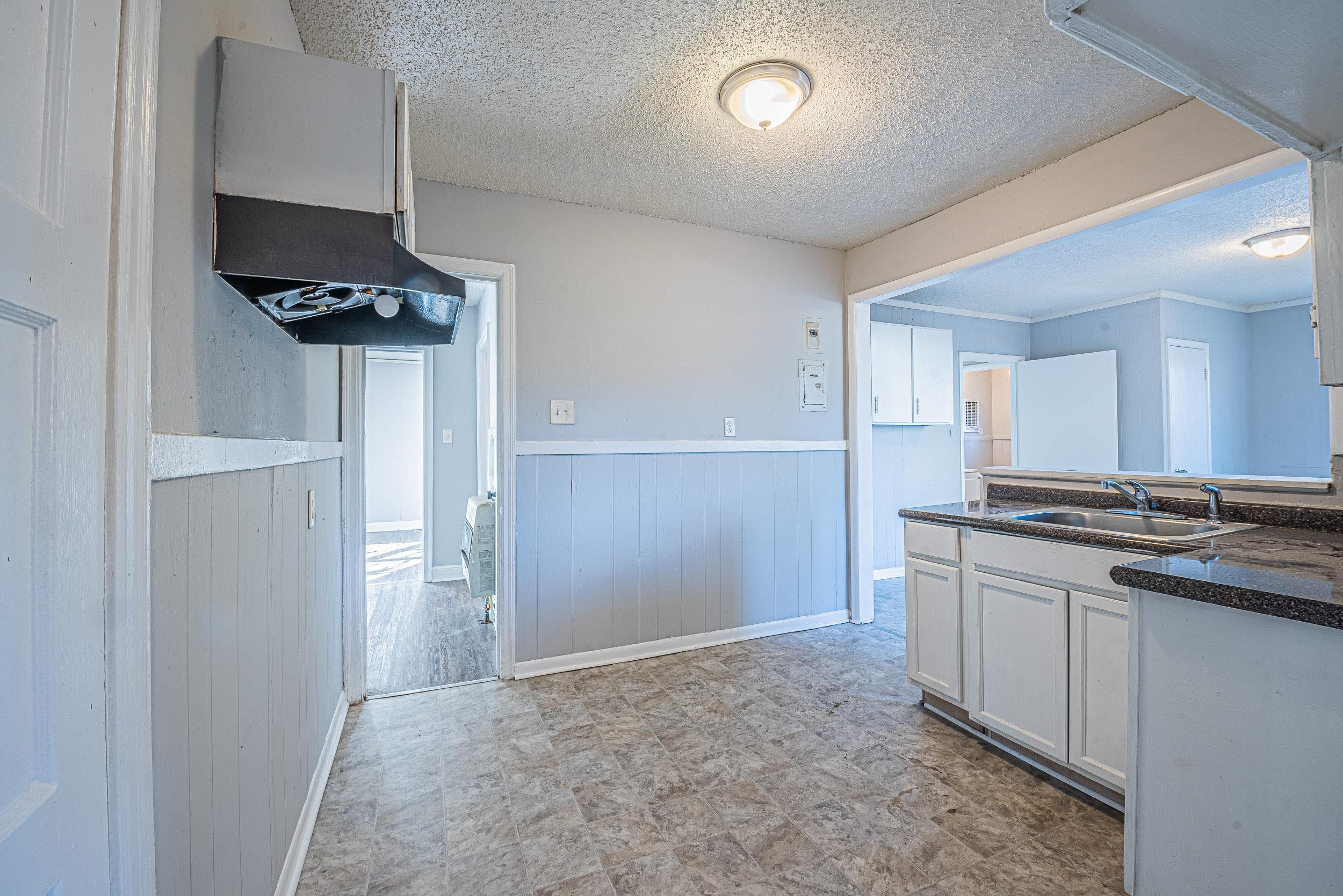 1109 Getwell Road Memphis, TN 38111 - Photo 10 of 22 a kitchen with stainless steel appliances a stove and a refrigerator