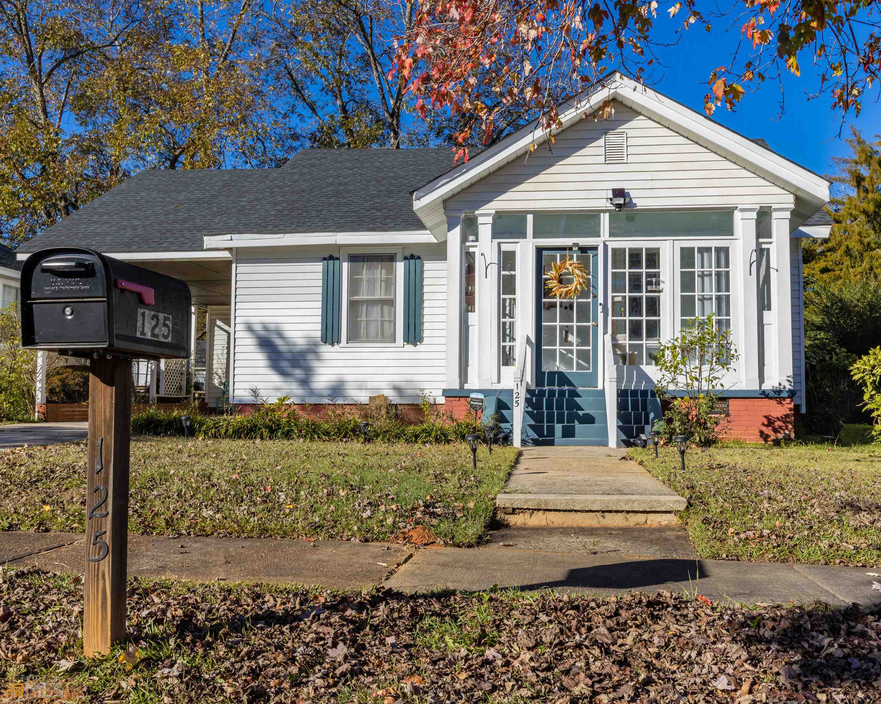 125 O Street Southwest Thomaston, GA 30286 - Photo 1 of 1 a front view of a house with garden