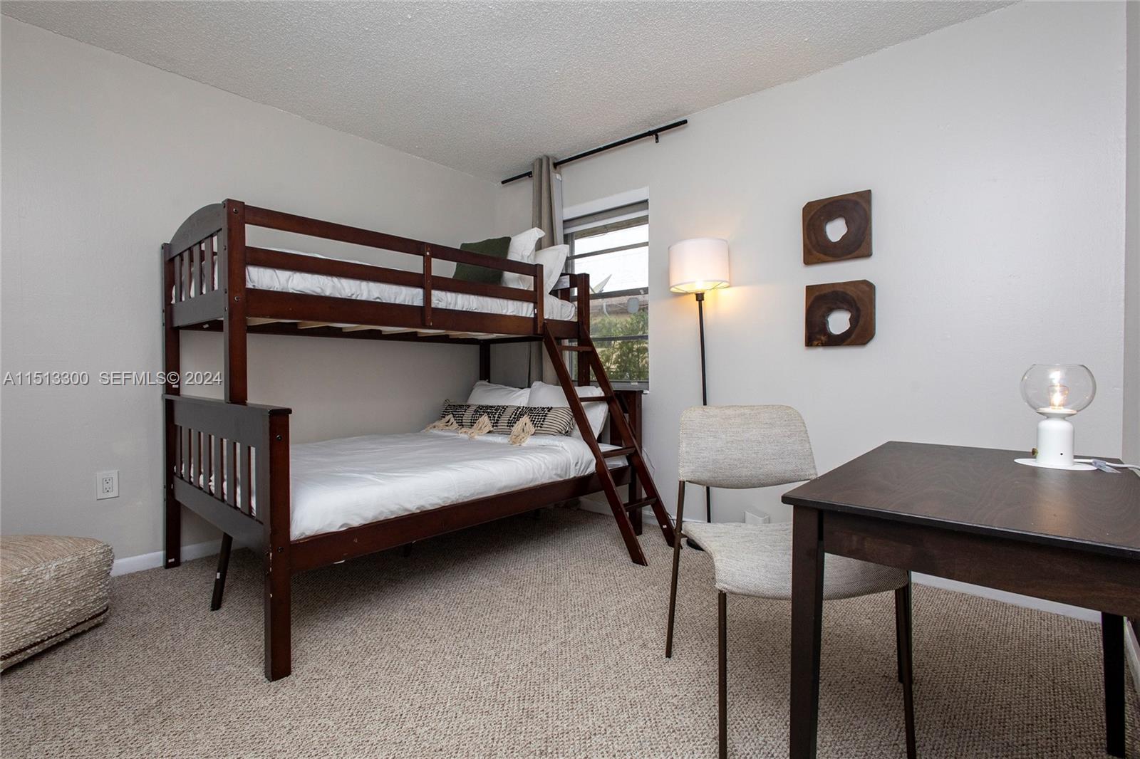 20075 Southwest 87th Place Cutler Bay, FL 33189 - Photo 24 of 32 a bedroom with a bunk bed and a desk