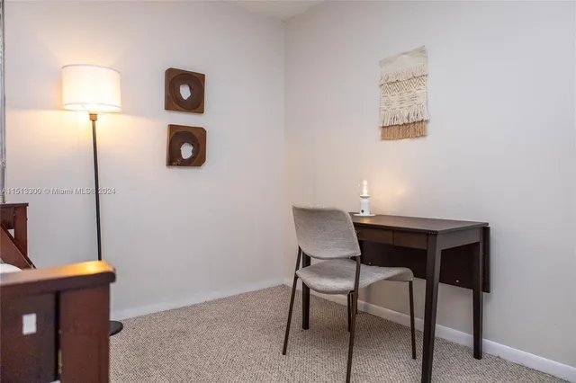 a view of a workspace with furniture