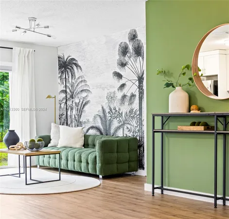 a living room with furniture and a mirror