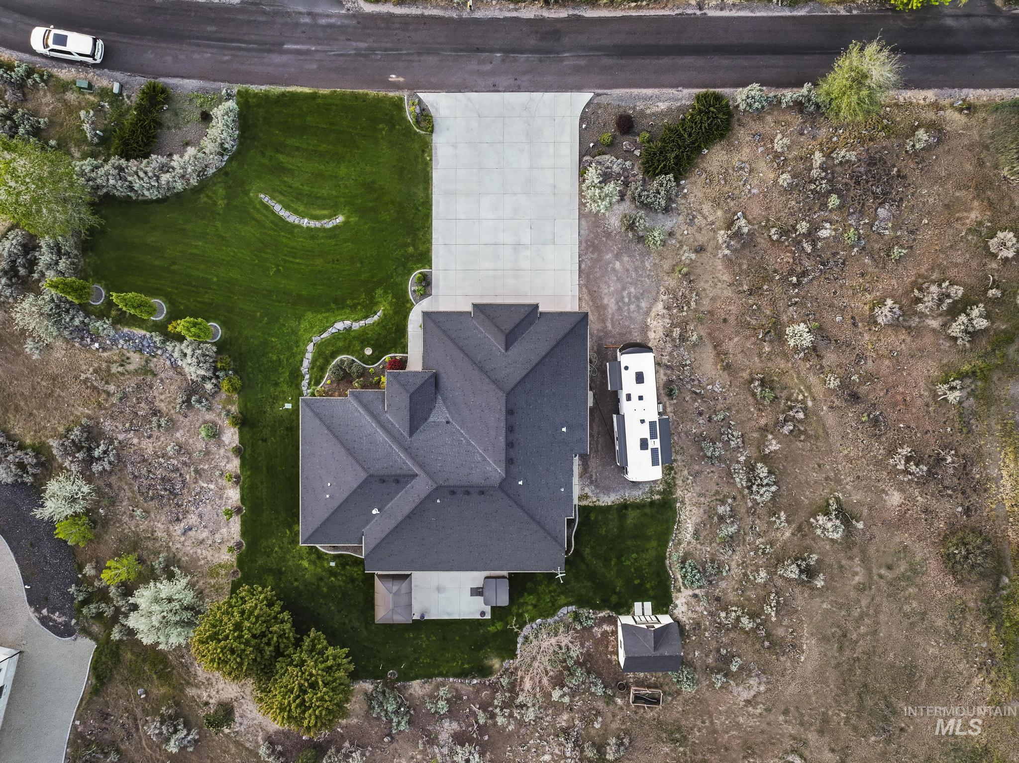 4152 North Meadow Ridge Circle Twin Falls, ID 83301 - Photo 50 of 50 Aerial property overview featuring a dark-shingled roofline, concrete driveway, and manicured lawns