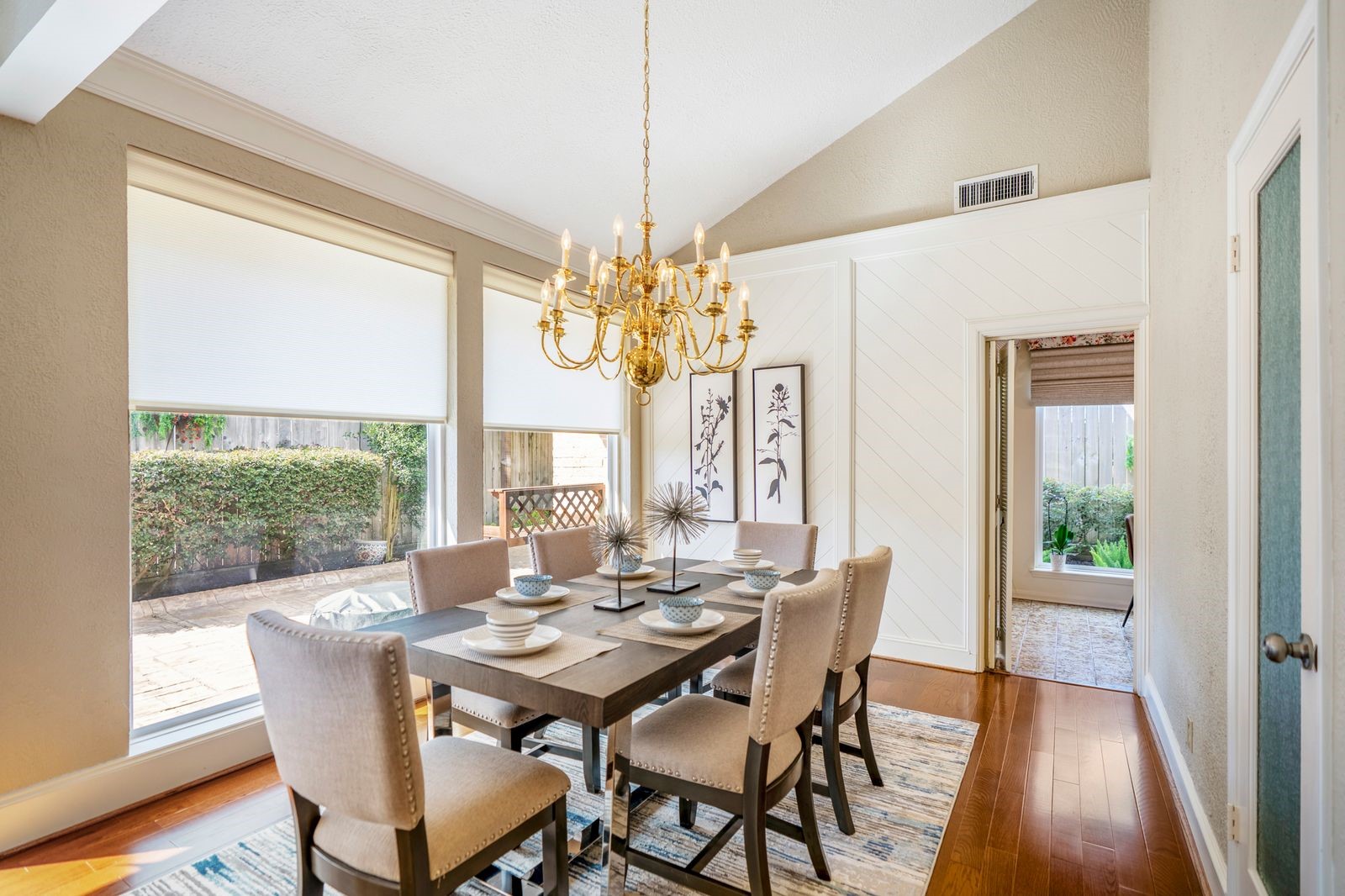 1306 Riverview Court Houston, TX 77077 - Photo 13 of 44 a view of a dining room with furniture wooden floor and chandelier