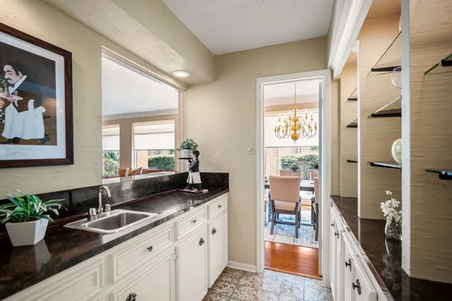 a spacious bathroom with a sink double vanity and a mirror