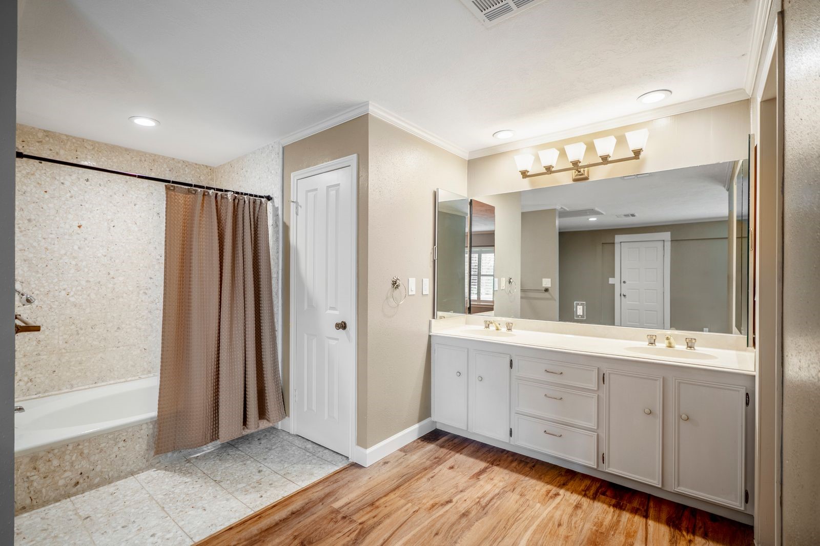 1306 Riverview Court Houston, TX 77077 - Photo 26 of 44 a bathroom with a double vanity sink and mirror