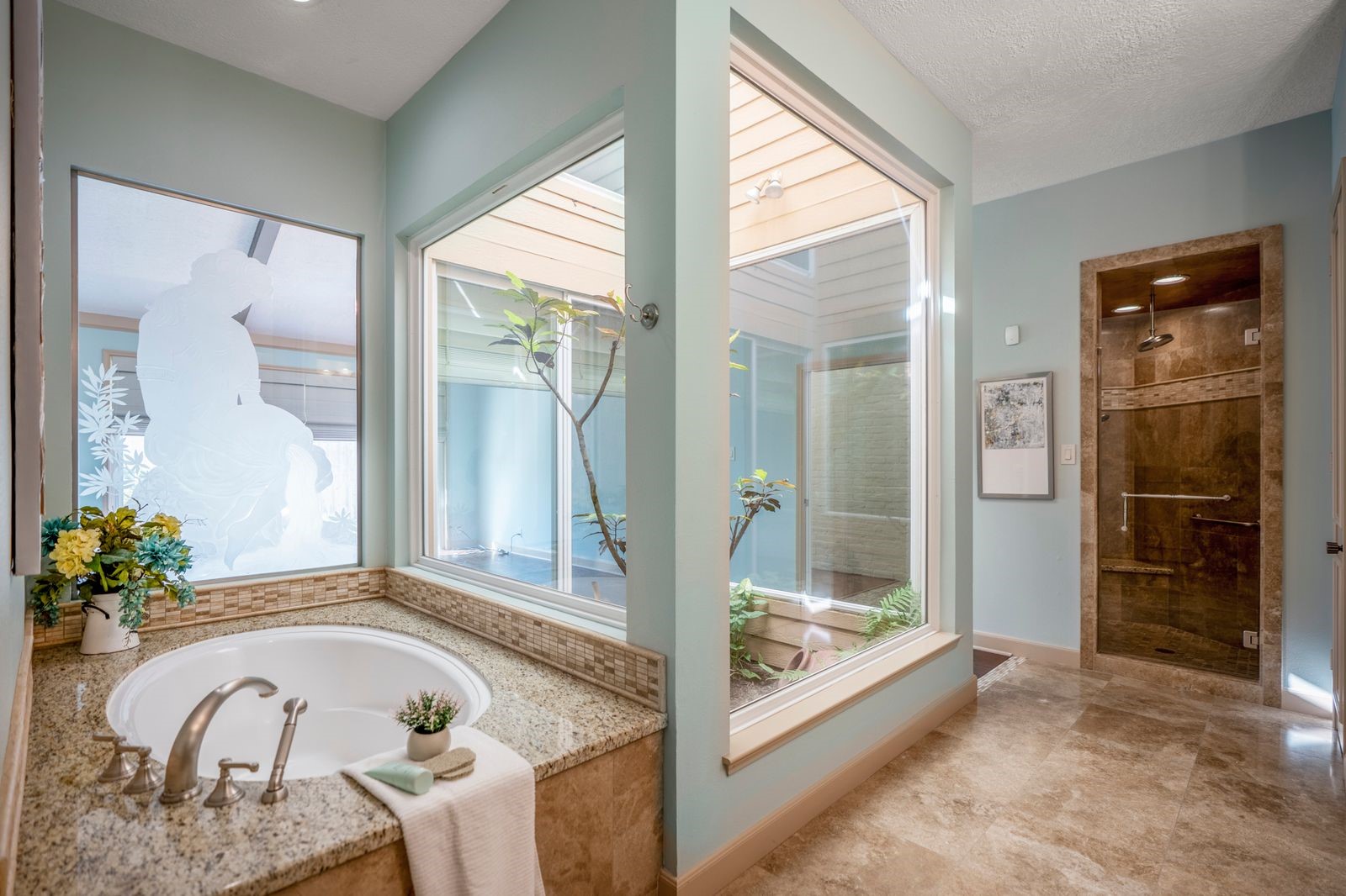 1306 Riverview Court Houston, TX 77077 - Photo 30 of 44 a bath tub sitting in a bathroom and mirror