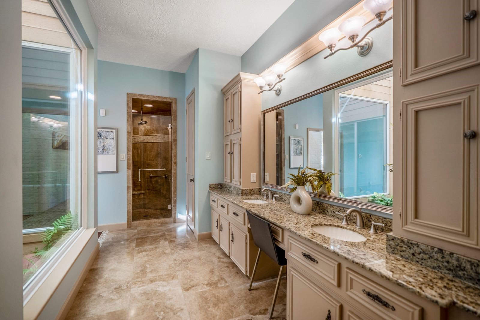 1306 Riverview Court Houston, TX 77077 - Photo 31 of 44 a spacious bathroom with a granite countertop sink and a mirror