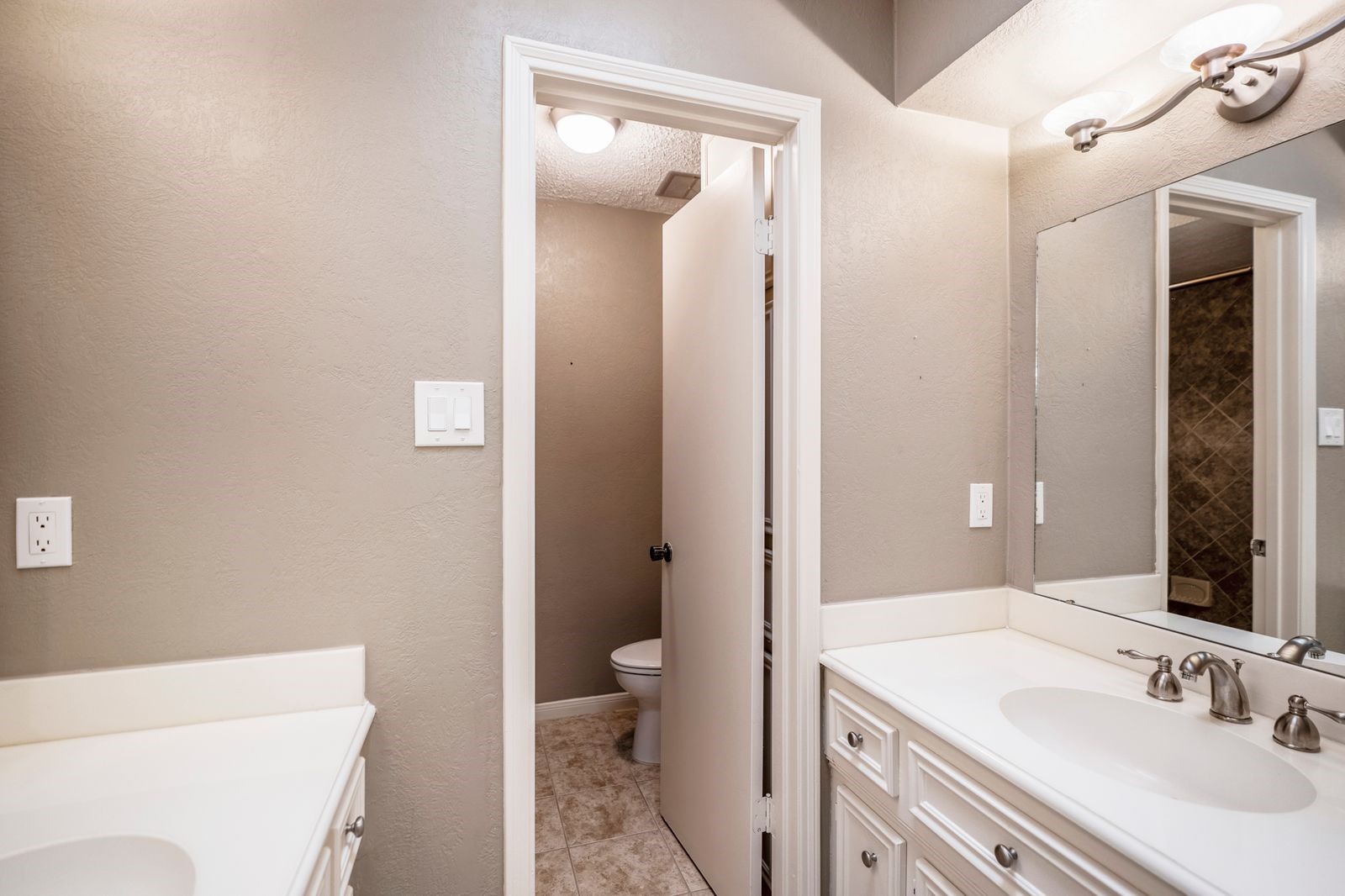 1306 Riverview Court Houston, TX 77077 - Photo 33 of 44 a bathroom with a sink a toilet and shower