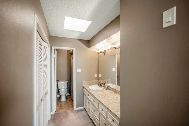 a view of a backyard with pathway