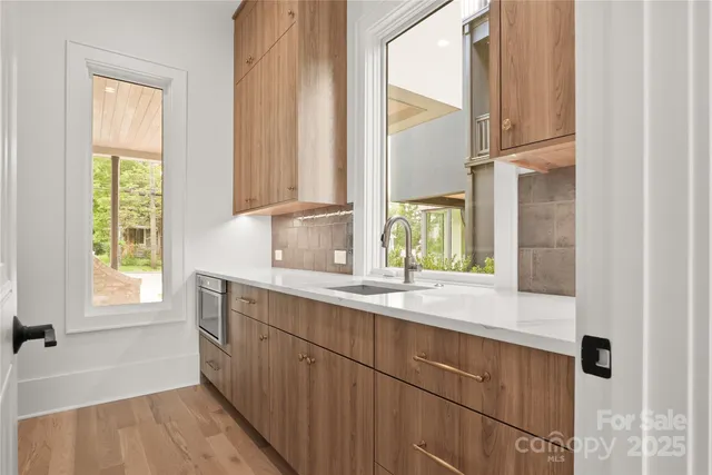a kitchen with a sink and a window