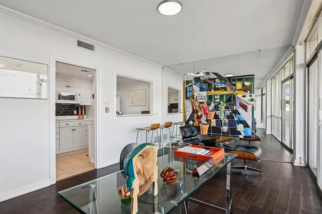 a room with furniture and gym equipment