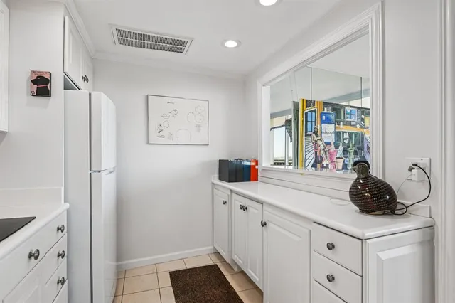 a kitchen with a sink a refrigerator and a stove