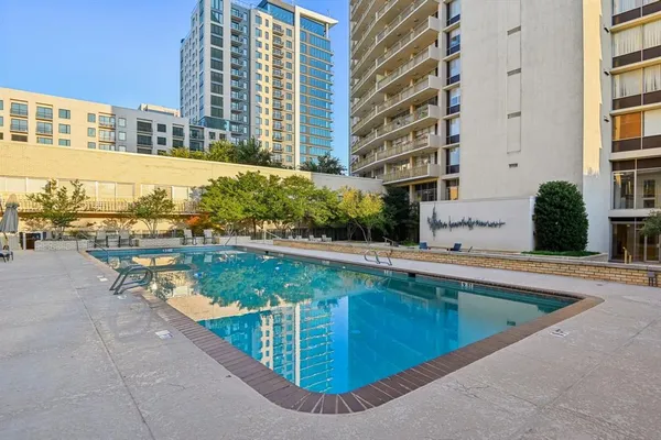 a view of swimming pool from a balcony