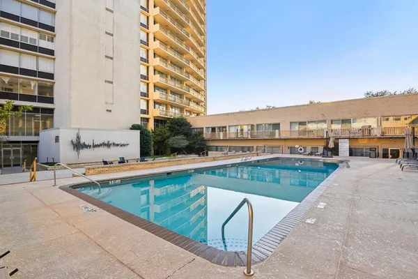 a view of an outdoor space and basketball court