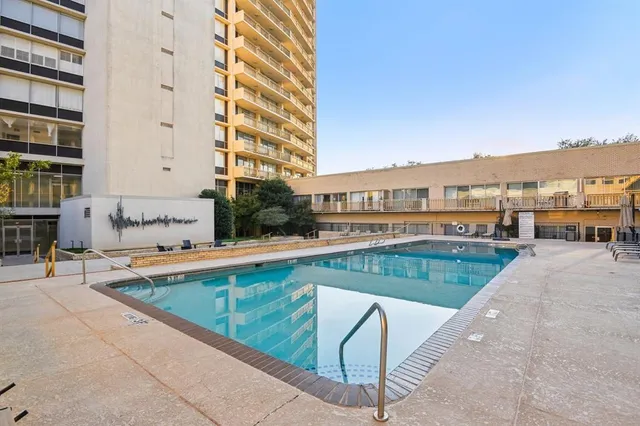 a view of an outdoor space and basketball court