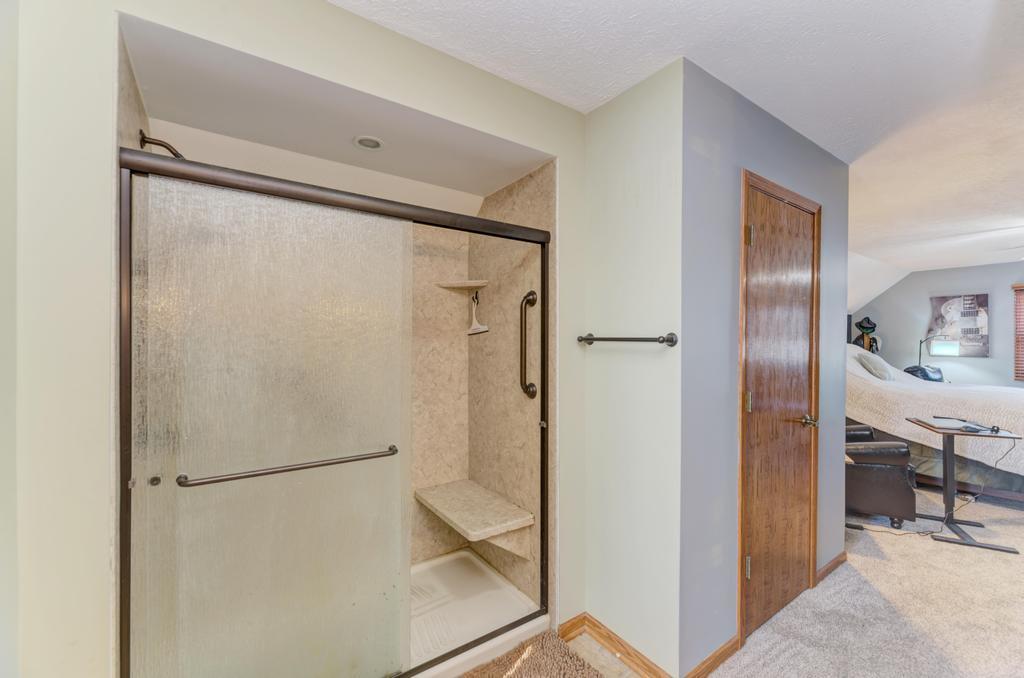 2402 Chestnut Lane Morris, IL 60450 - Photo 22 of 30 a bathroom with a glass shower door and a sink
