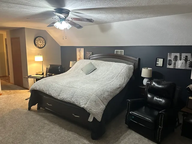 a bedroom with bed and window