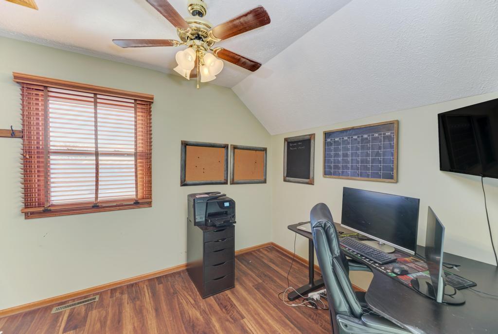 2402 Chestnut Lane Morris, IL 60450 - Photo 24 of 30 a workspace with wooden floor and a window