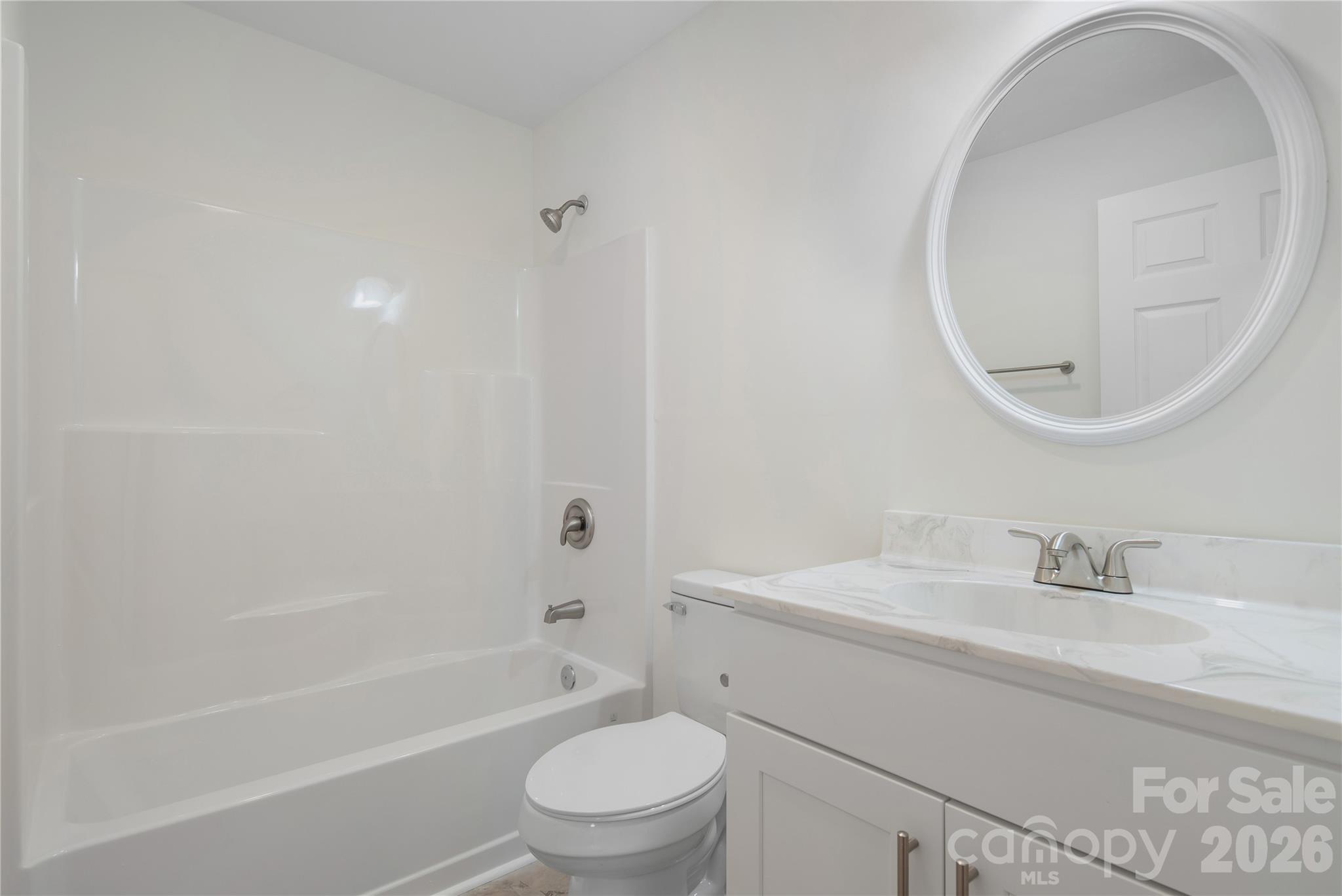 287 Duncan Road Flat Rock, NC 28731 - Photo 13 of 13 a bathroom with a sink a toilet and a mirror