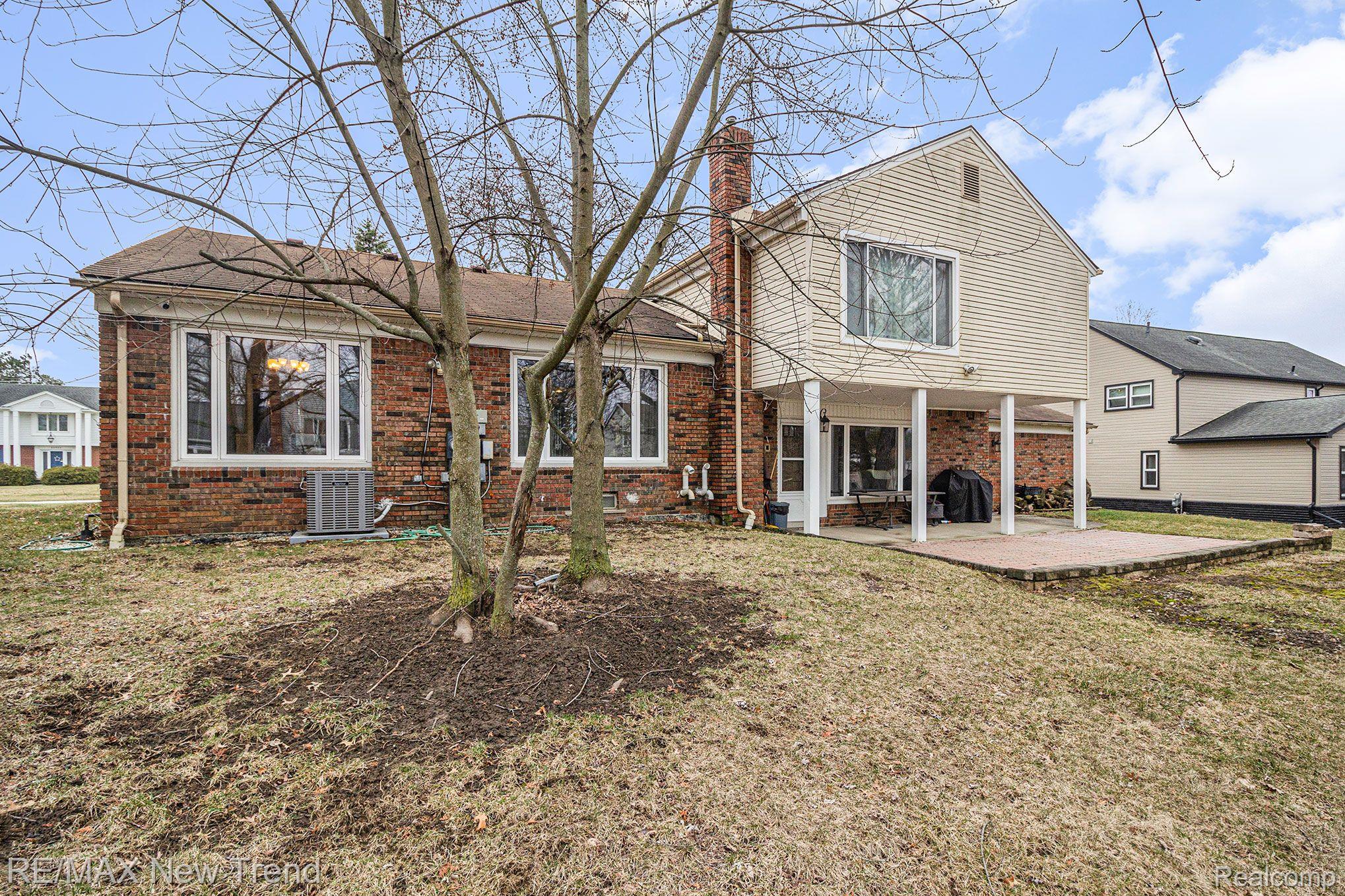 35946 Johnstown Road Farmington, MI 48335 - Photo 43 of 50 Rear Exterior w/ Patio & Backyard
