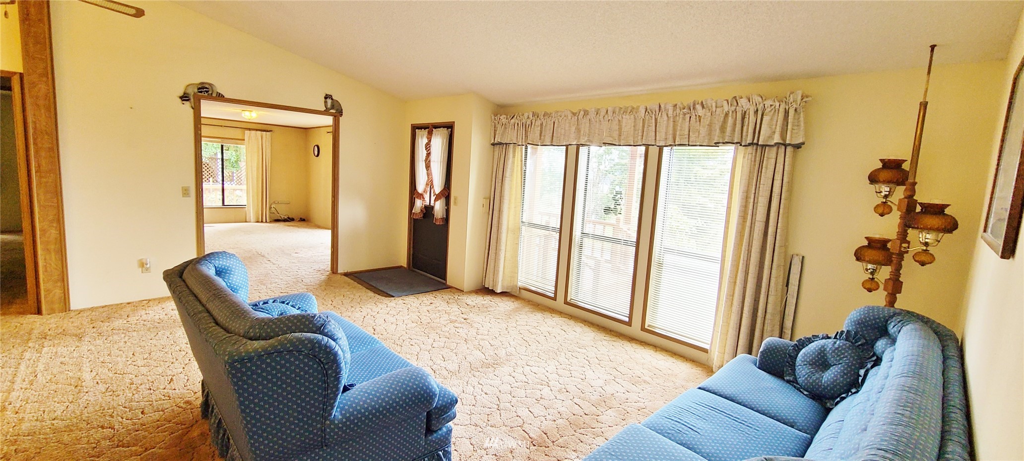 410 Discovery Way Sequim, WA 98382 - Photo 11 of 34 a living room with furniture and a large window
