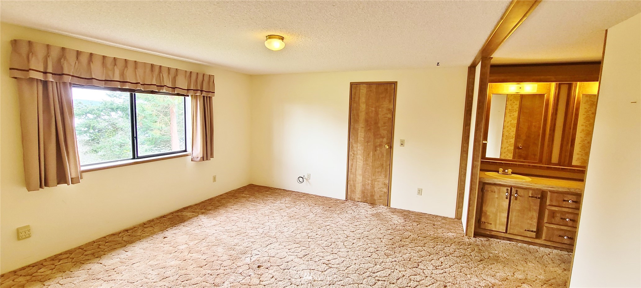 410 Discovery Way Sequim, WA 98382 - Photo 15 of 34 a view of an empty room with a window