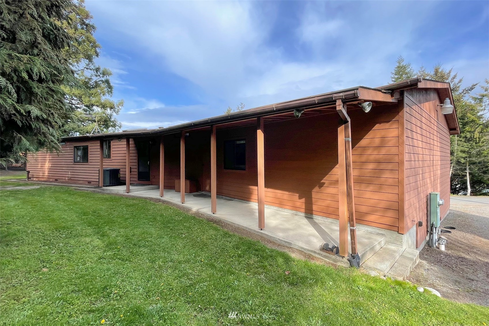 410 Discovery Way Sequim, WA 98382 - Photo 25 of 34 a view of backyard with a garden and deck