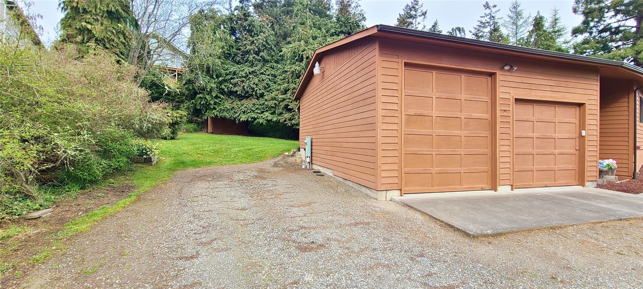 410 Discovery Way Sequim, WA 98382 - Photo 6 of 34 a view of backyard of house and trees