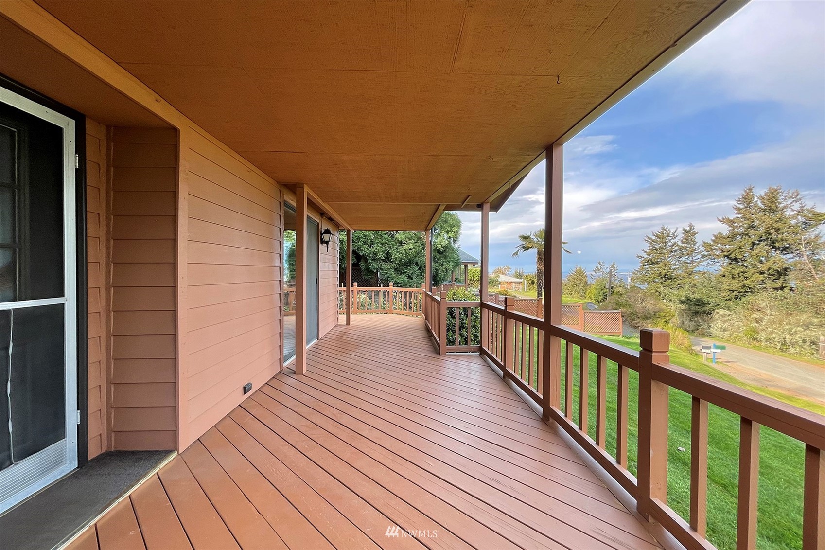 410 Discovery Way Sequim, WA 98382 - Photo 7 of 34 a view of a balcony with wooden floor