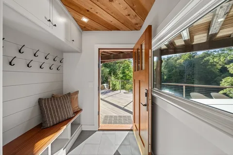 a view of a balcony with wooden floor