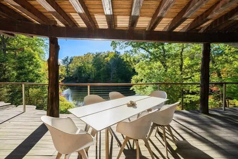 a view of a patio with a table chairs and a table