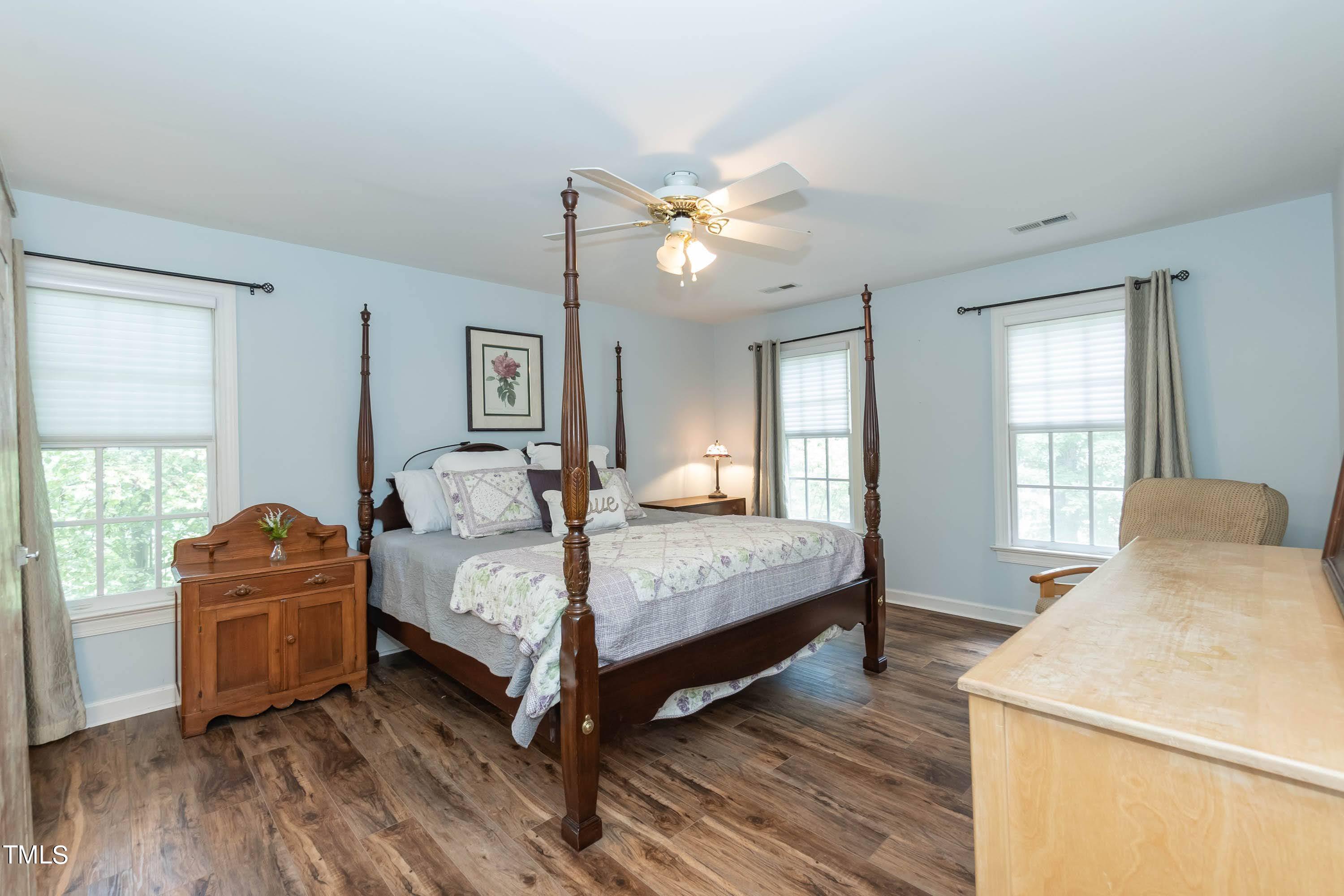 4112 Ridgebrook Bluffs Drive Raleigh, NC 27603 - Photo 27 of 40 Welcome to your primary retreat with low maintenance floors and plenty of natural light.