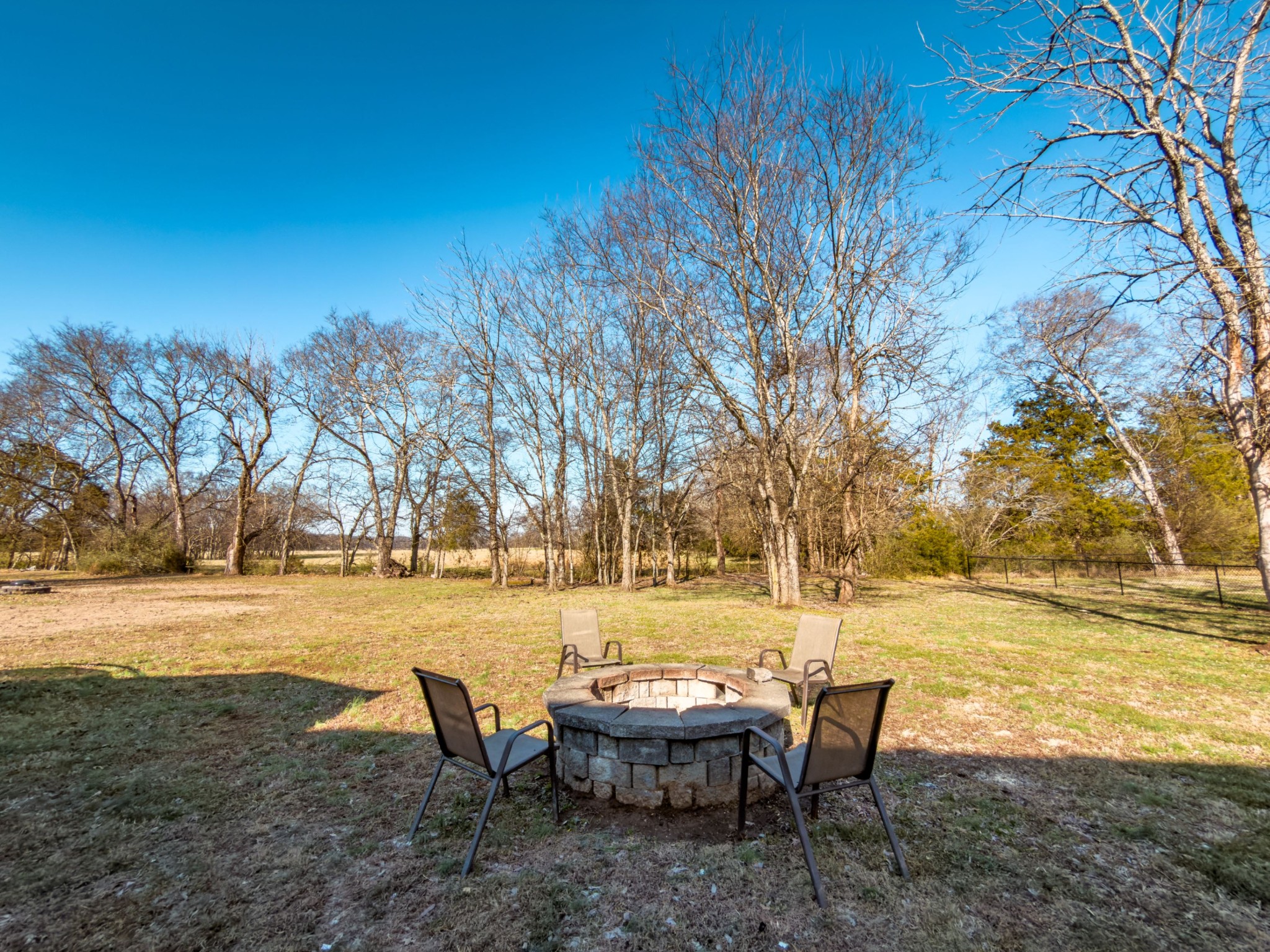 1122 Thompson Farms Street Lascassas, TN 37085 - Photo 12 of 12 a view of a lake with table and chairs