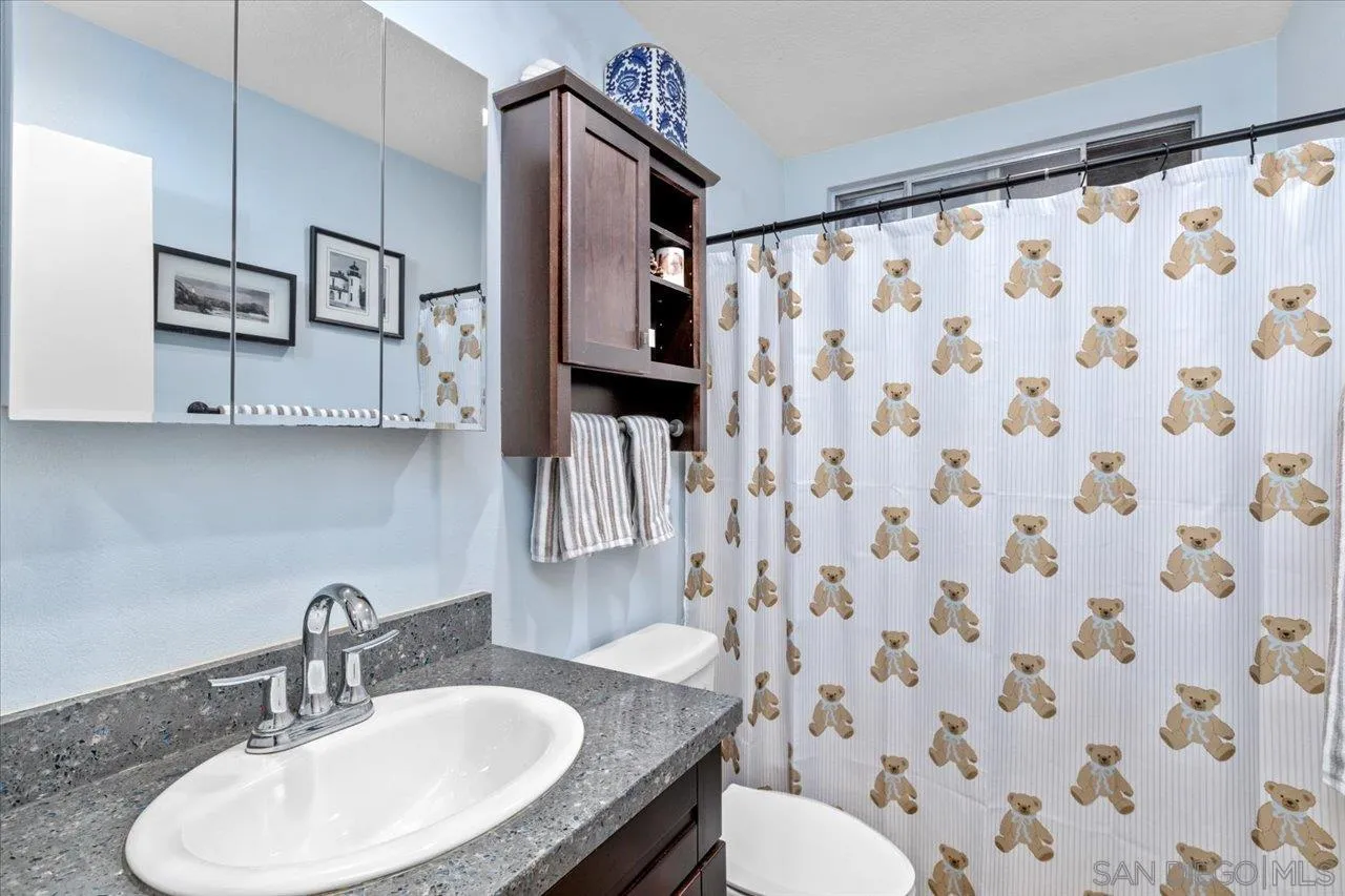 2337 Fallingleaf Road Oceanside, CA 92056 - Photo 22 of 34 a bathroom with a sink toilet and shower