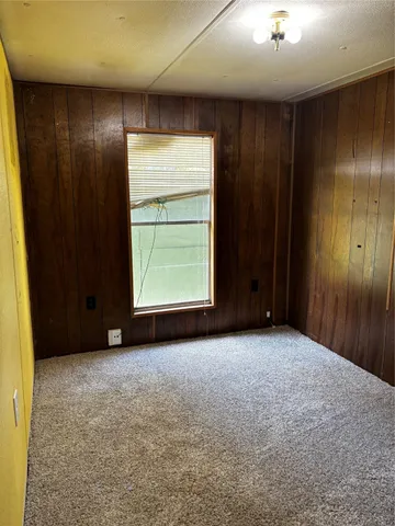 a view of swimming pool with a patio and a yard