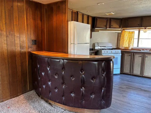 a view of a kitchen with a sink and cabinets
