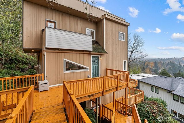 a view of a patio with a table and chairs