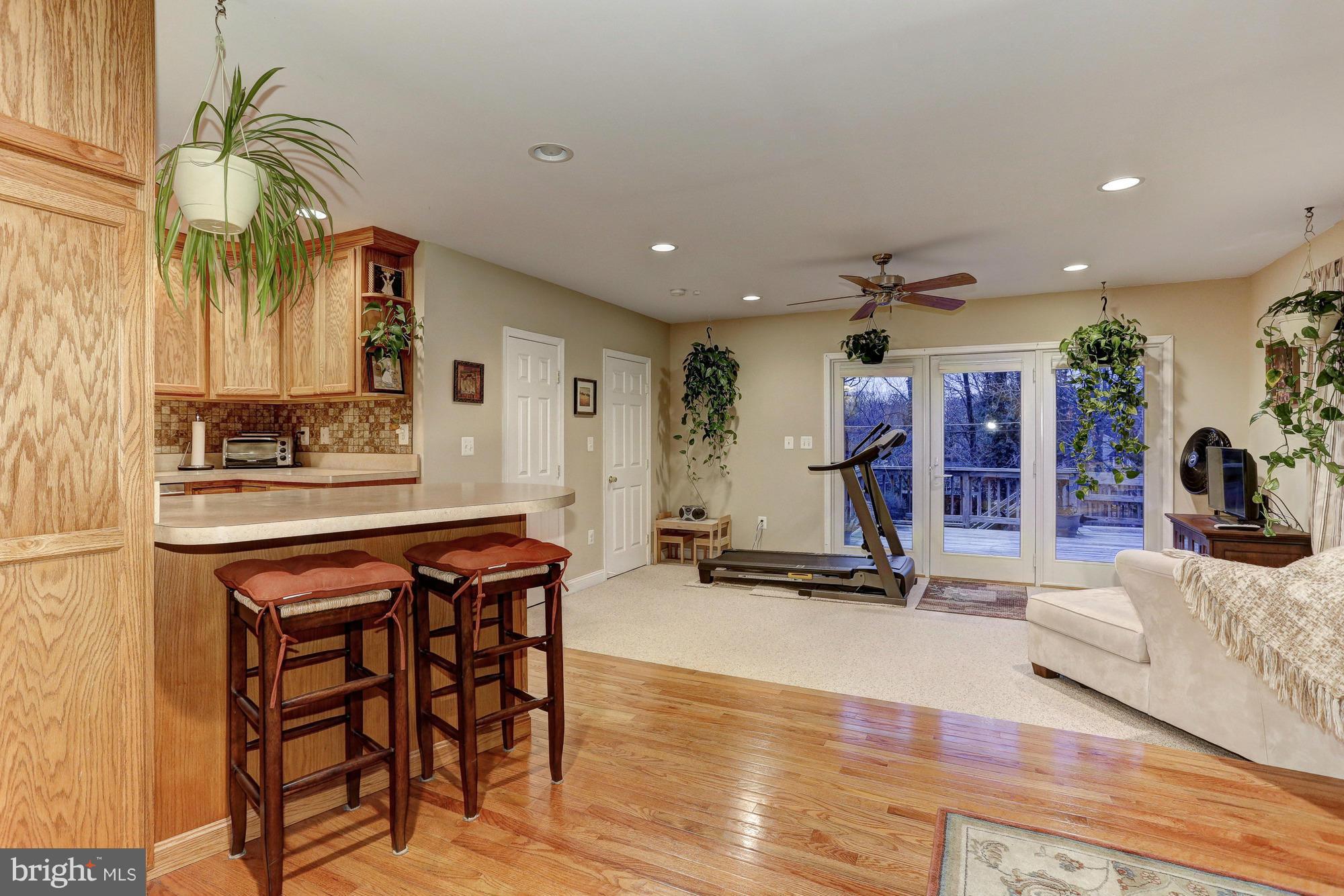 6412 Sherwood Road Baltimore, MD 21239 - Photo 2 of 30 Breakfast room leads to huge family room.