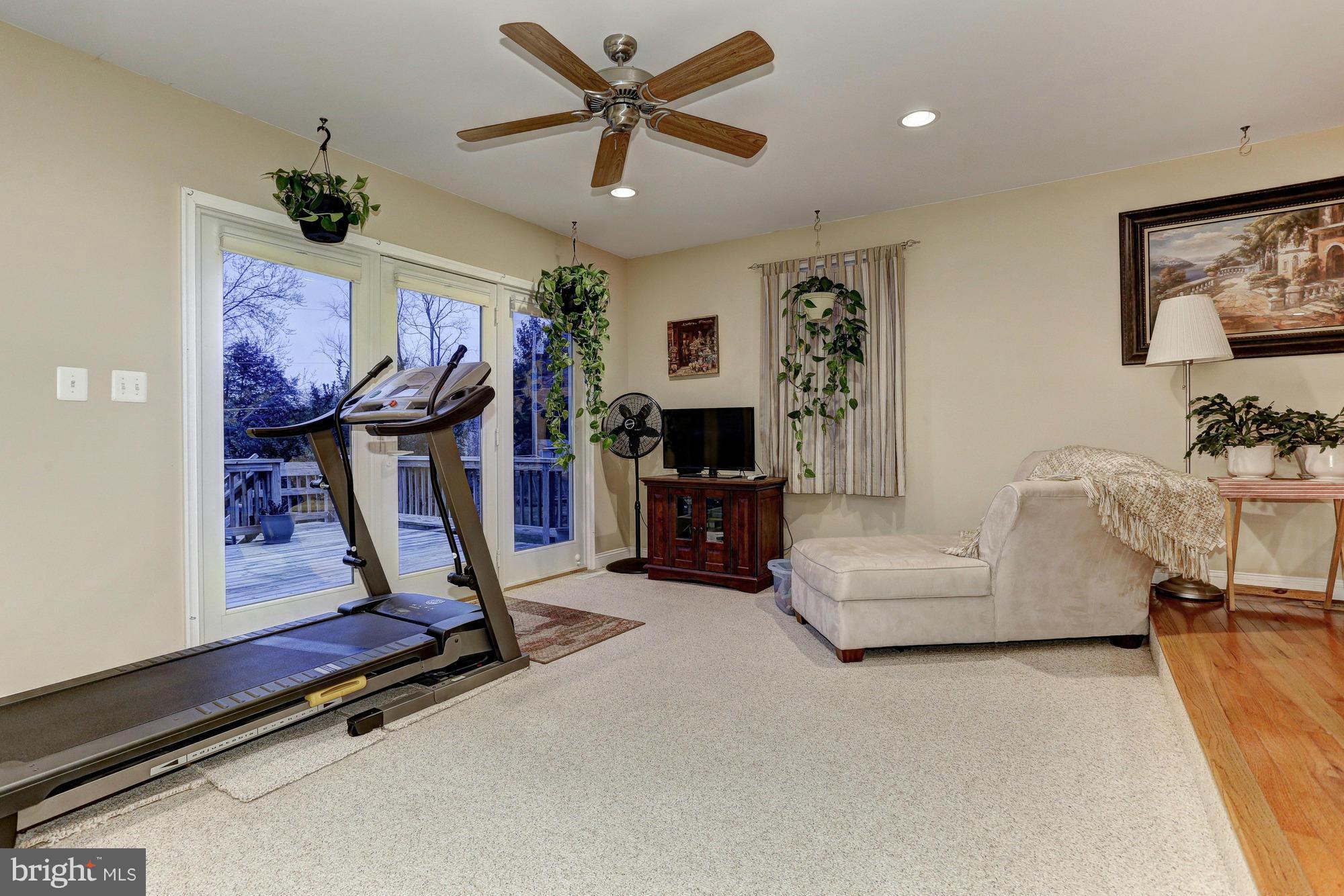 6412 Sherwood Road Baltimore, MD 21239 - Photo 17 of 30 Family Room w/ entry to deck, half bath.