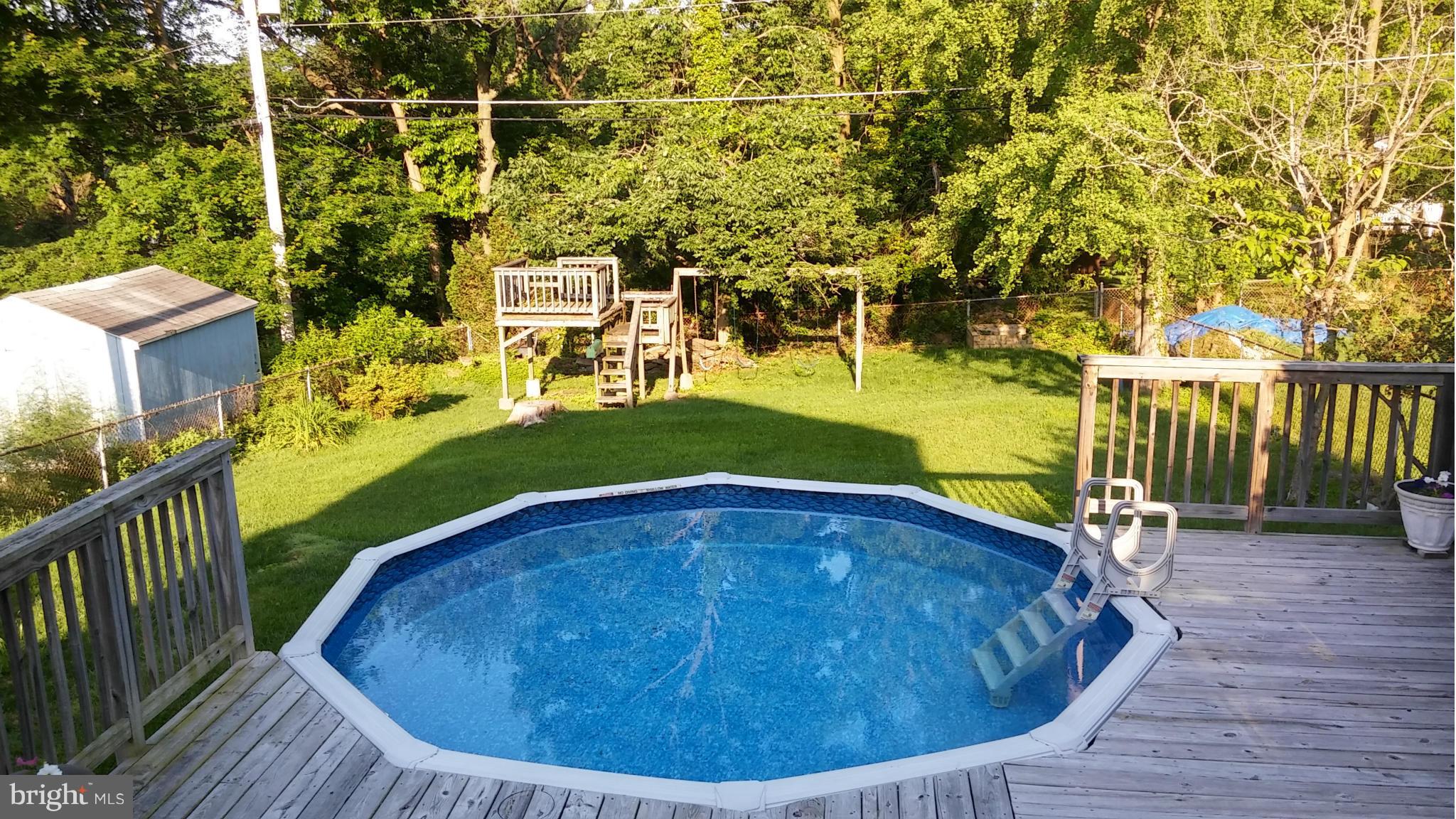 6412 Sherwood Road Baltimore, MD 21239 - Photo 4 of 30 Fantastic backyard with pool, playset
