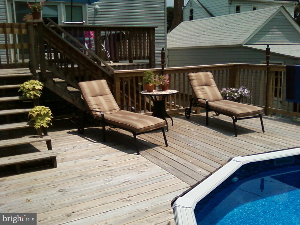 6412 Sherwood Road Baltimore, MD 21239 - Photo 5 of 30 Deck surrounds pool